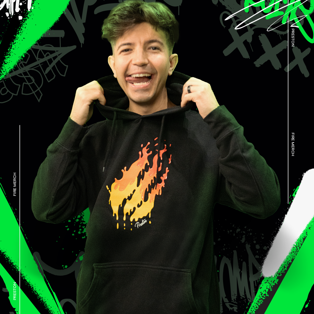Person wearing a black hoodie with a colorful design, standing against a black background with green and white abstract elements.